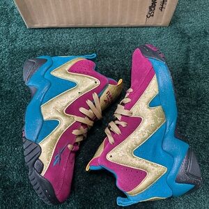Reebok Questions Vibrant Pink and Gold Sneakers